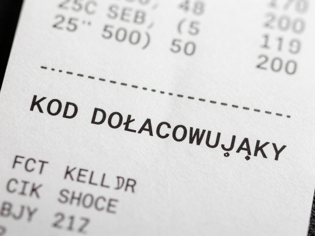 Fragment paragonu z wyróżnionym kodem doładowującym Fragment paragonu z wyróżnionym kodem doładowującym